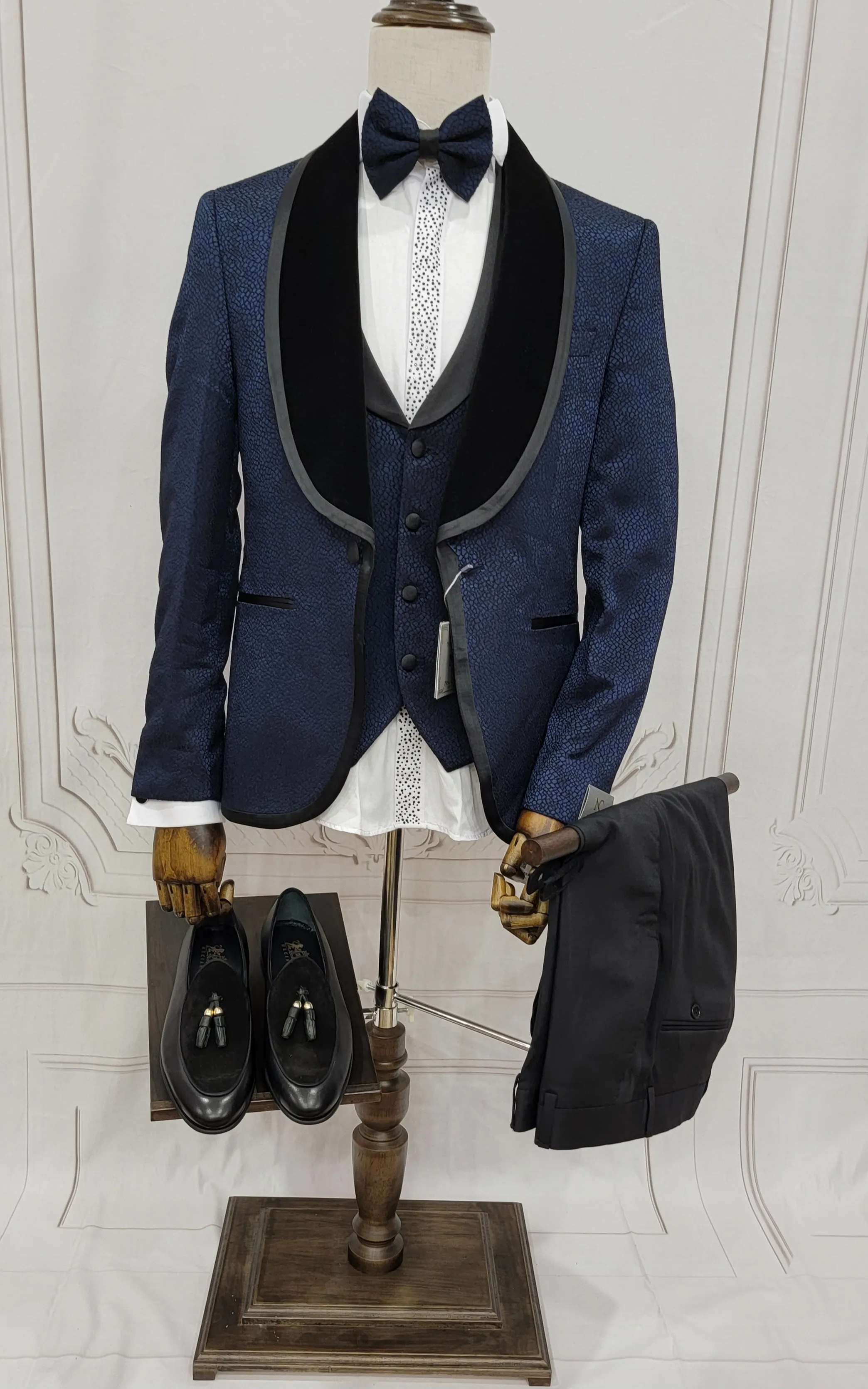 Single button three piece men's Suit with contrasting black velvet lapel, matching bow tie and Black Pants