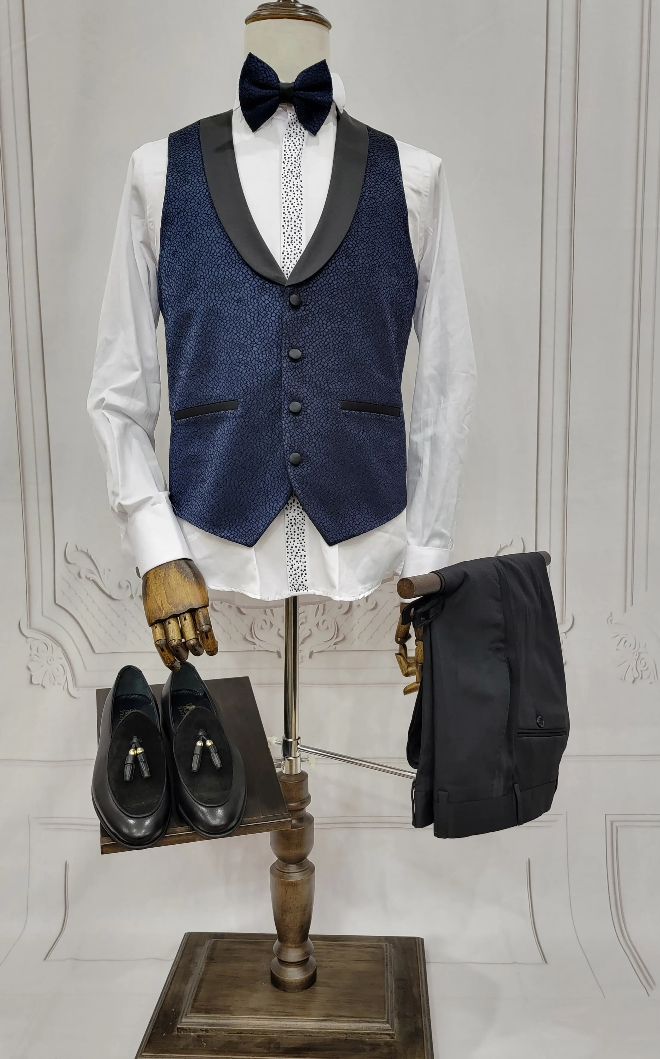 Single button three piece men's Suit with contrasting black velvet lapel, matching bow tie and Black Pants
