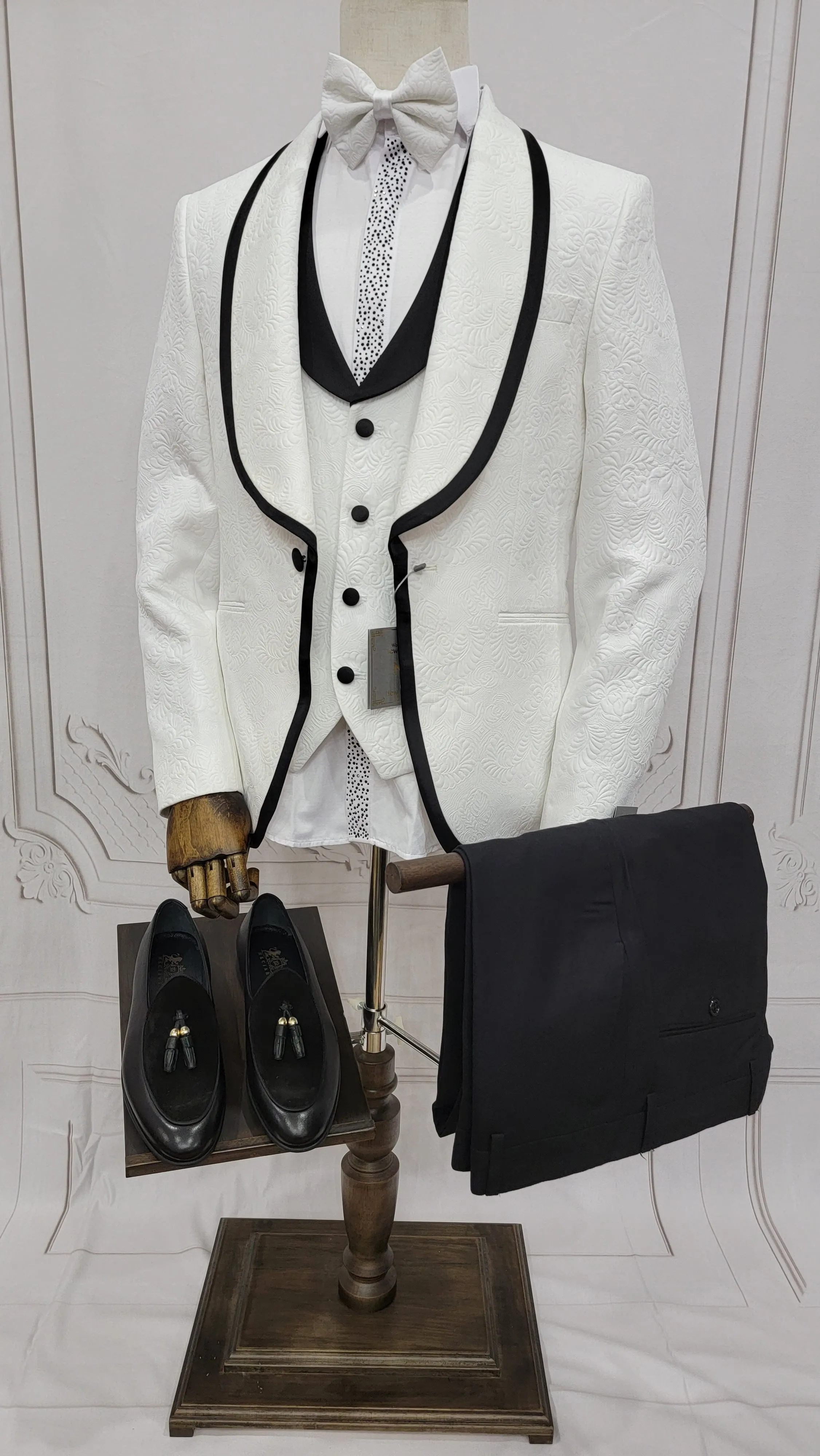 Three Pieces Tuxedo Suit with Contrasting Black tapered Lapel, matching bow tie and Black Pants.