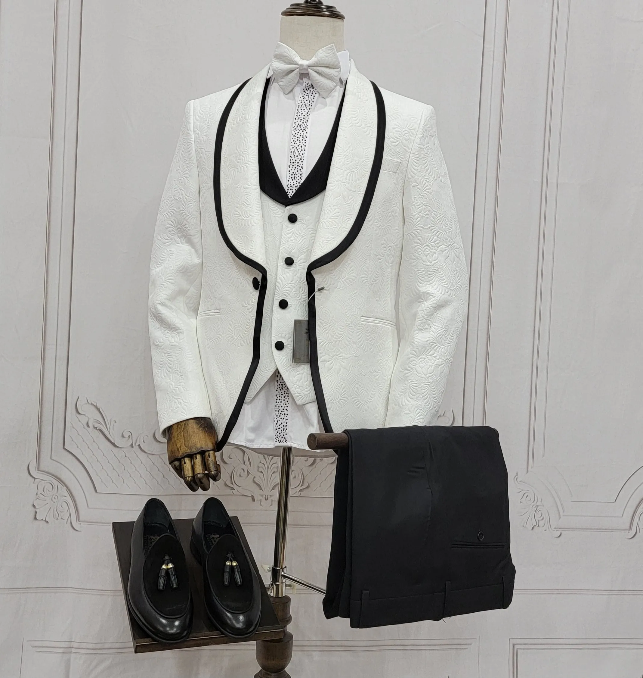 Three Pieces Tuxedo Suit with Contrasting Black tapered Lapel, matching bow tie and Black Pants.