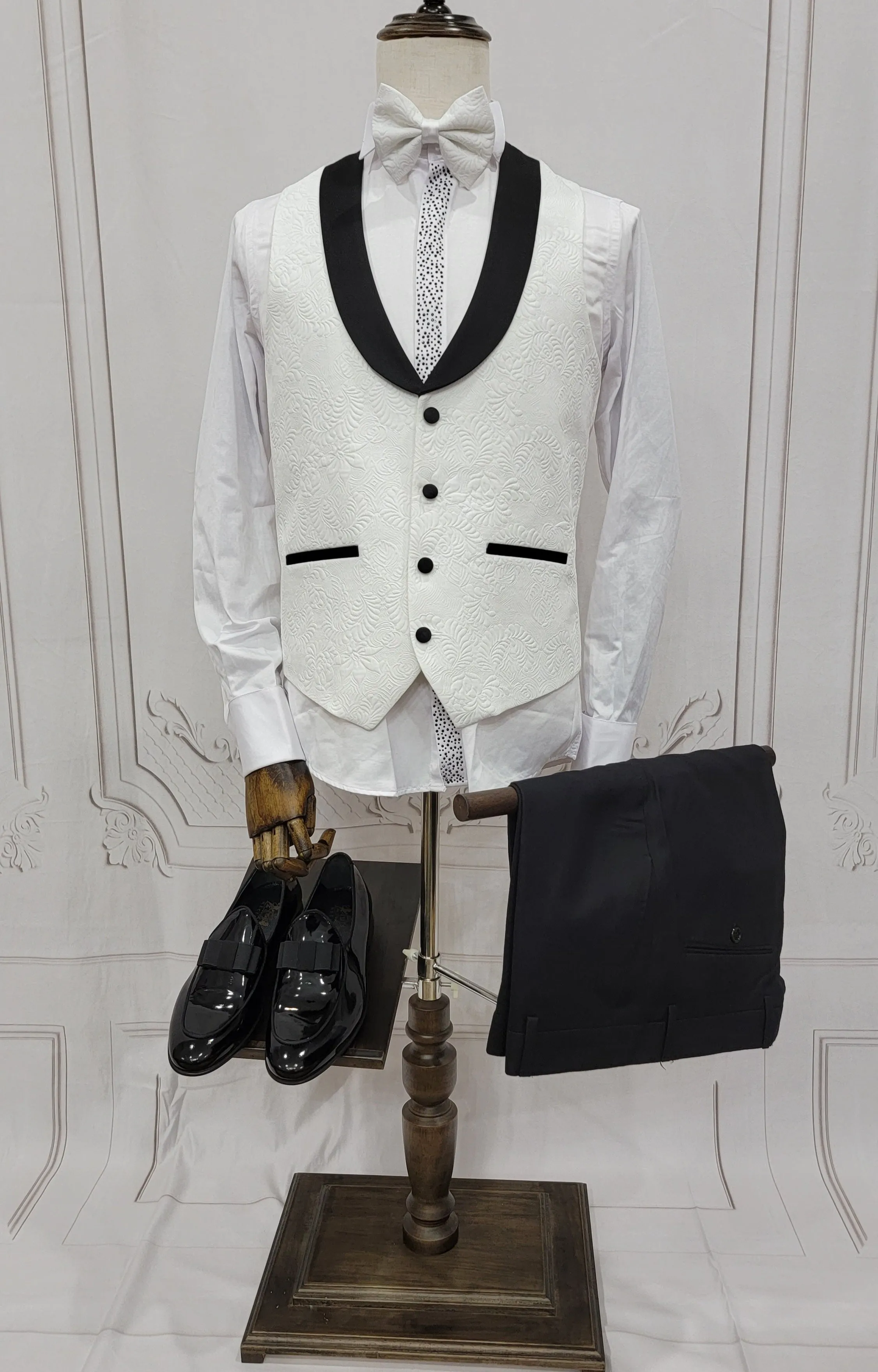 Three Pieces Tuxedo Suit with Contrasting Black tapered Lapel, matching bow tie and Black Pants.