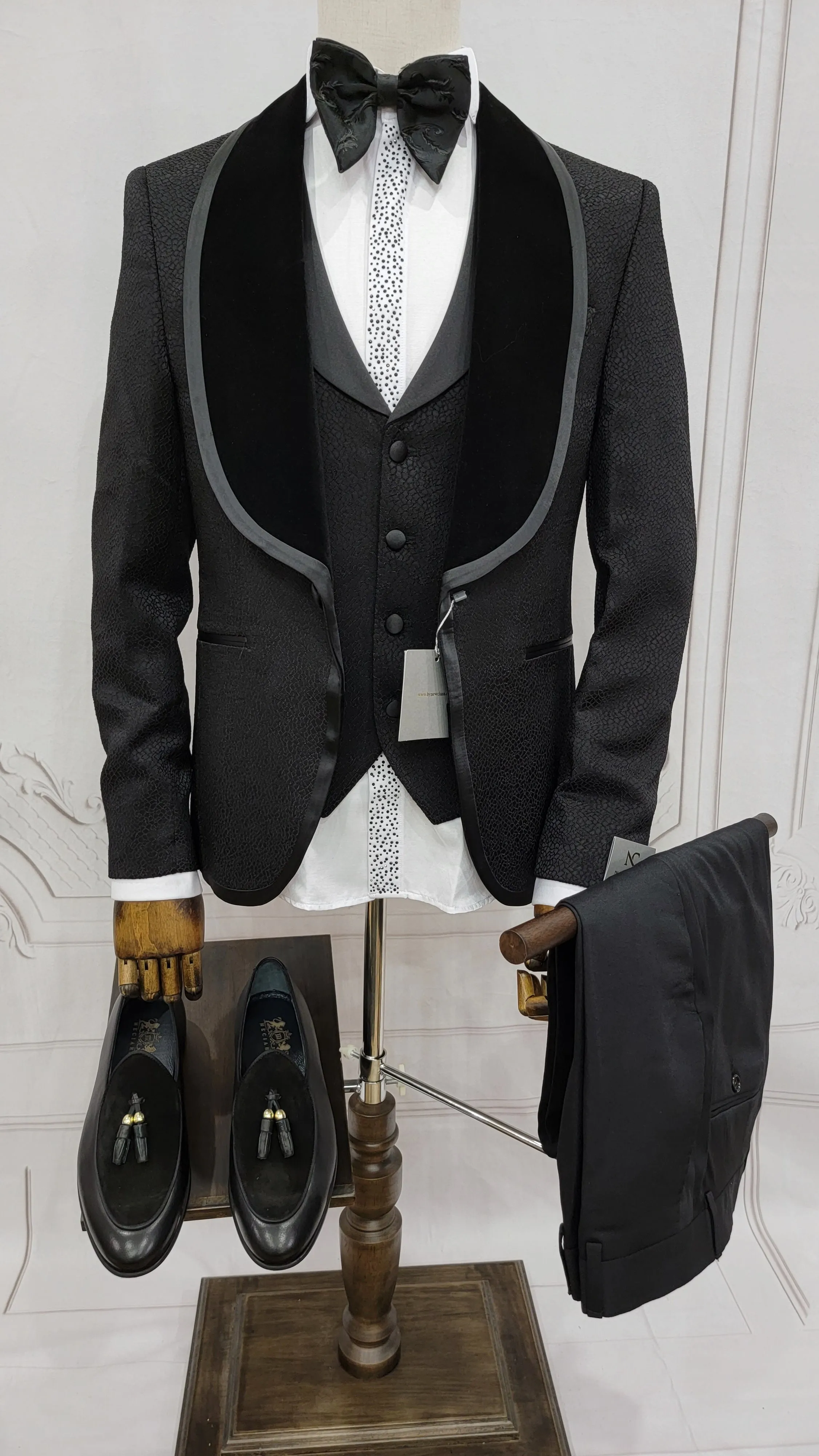 Three Pieces Tuxedo Suit with Contrasting Black velvet Lapel, matching bow tie and Black Pants.