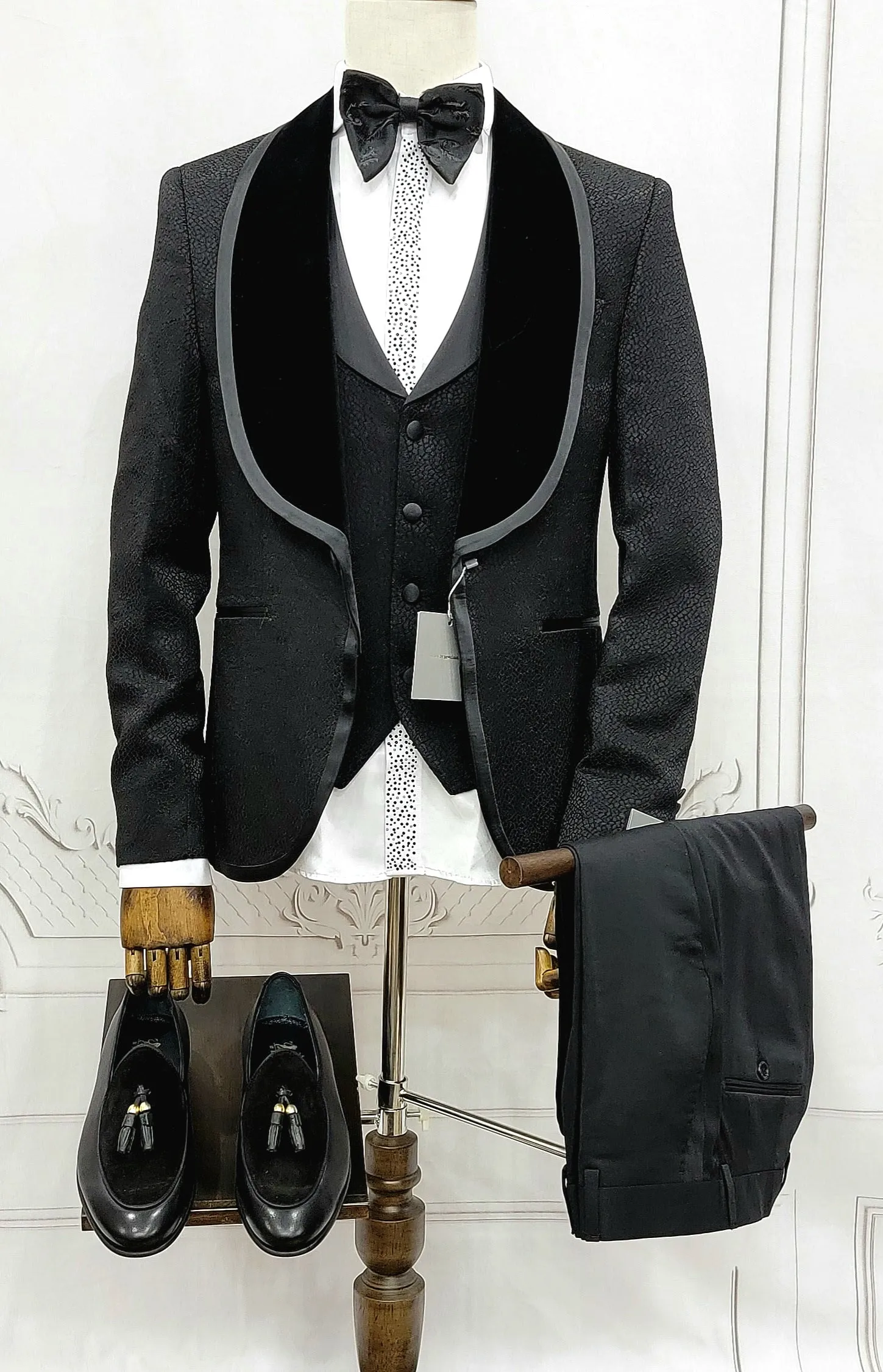Three Pieces Tuxedo Suit with Contrasting Black velvet Lapel, matching bow tie and Black Pants.