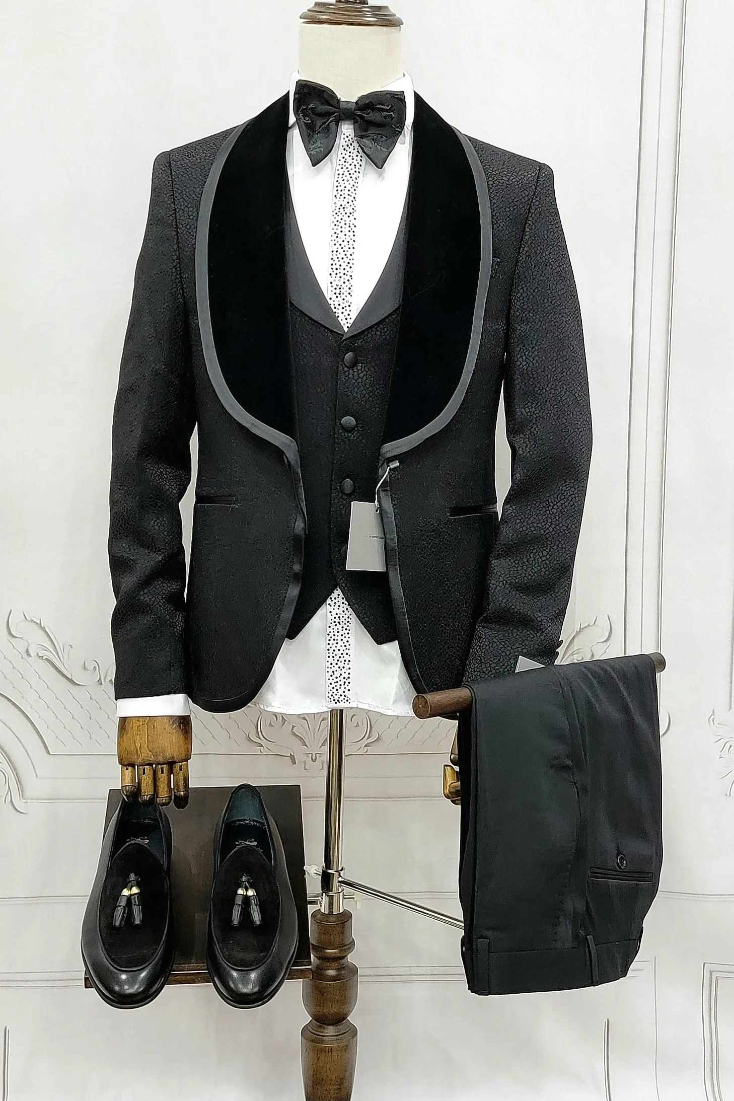 Three Pieces Tuxedo Suit with Contrasting Black velvet Lapel, matching bow tie and Black Pants.